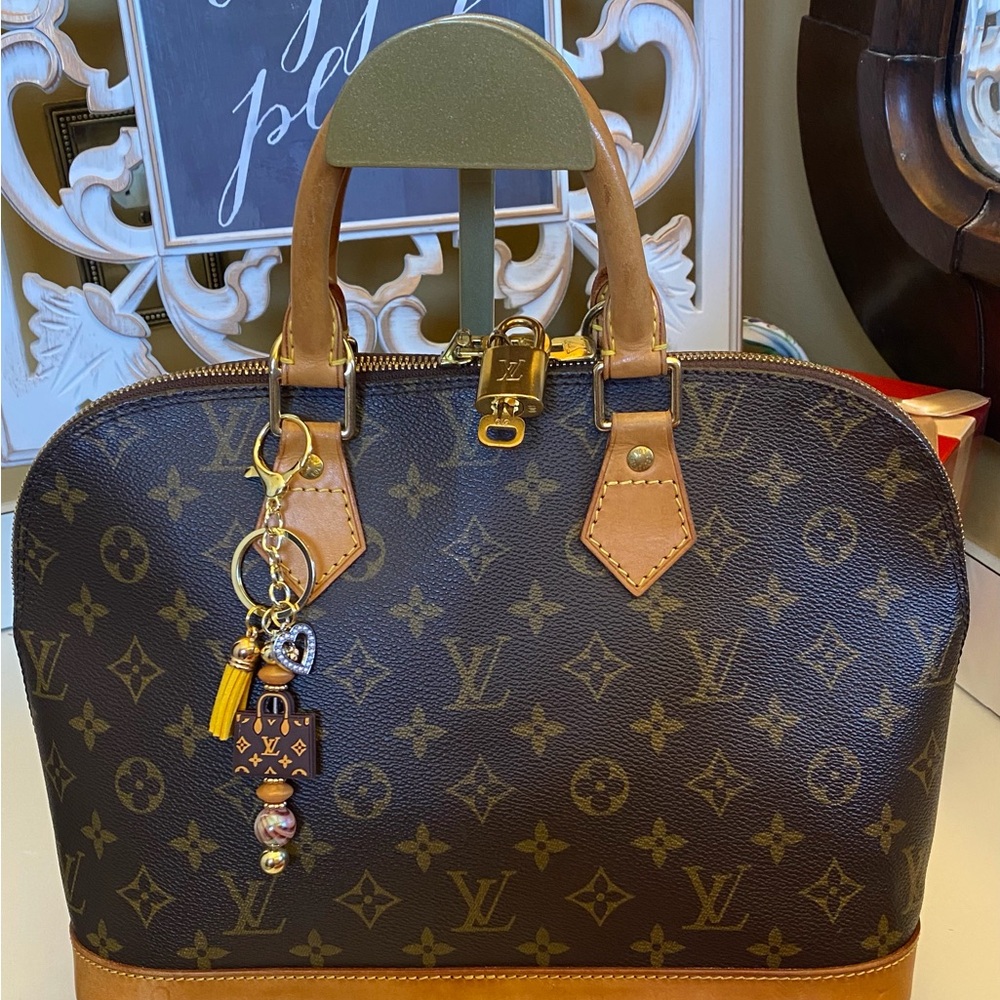 Louis Vuitton Alma Brown and Tan Hand Bag with Monogram Canvas
